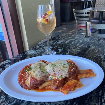 Ferraro's Italian Grille - White sangria and lunch portion of Eggplant Parmigiana - Italian Near Me - Parrish, Florida