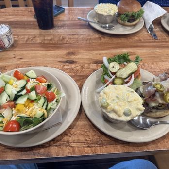 Udderly Divine - (left)Regular garden salad with ranch dressing on the side. (Right) Mac n cheese with Hatch Chili and cheese burger w/bacon n jalapeños. - Breakfast & Brunch Near Me - Camp Verde, Arizona