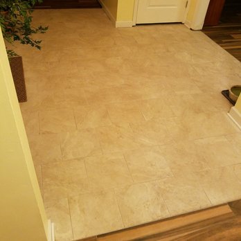 Classic Remodeling - Wood tile that transitions seamlessly to the foyer tile - General Contractors Near Me - Lombard, Illinois