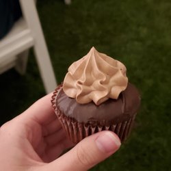 Sweetspot - A close up photo of one of the chocolate cupcakes in someone's hand