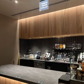 Starbucks - a coffee bar with a sign above the counter - Coffee & Tea Near Me - Springtown, Texas