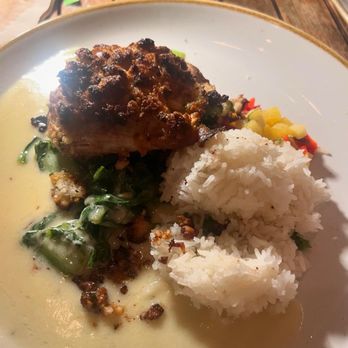 Monkeypod Kitchen by Merriman - Organic Macadamia Nut Crusted Mahi Mahi. Small scope of rice and a tiny bit of pineapple relish. - New American Near Me - Kihei, Hawaii Monkeypod Kitchen by Merriman - Organic Macadamia Nut Crusted Mahi Mahi. Small scope of rice and a tiny bit of pineapple relish. - New American Near Me - Kihei, Hawaii