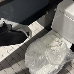 Out of order toilet, and paper dispenser ripped off the wall. Out of order toilet, and paper dispenser ripped off the wall.