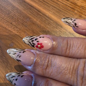 DB Nails and Spa - Charged for shape? They look like slopes going up. Not a natural curve of nail. Same issues as left hand. - Nail Salons Near Me - Lubbock, Texas DB Nails and Spa - Charged for shape? They look like slopes going up. Not a natural curve of nail. Same issues as left hand. - Nail Salons Near Me - Lubbock, Texas