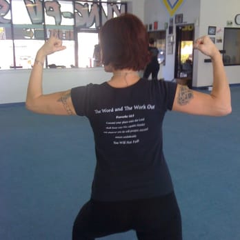 Praise Aerobics - One of the floor trainers on the Praise Aerobics team flexing her muscles. - Gyms Near Me - Riverside, California Praise Aerobics - One of the floor trainers on the Praise Aerobics team flexing her muscles. - Gyms Near Me - Riverside, California