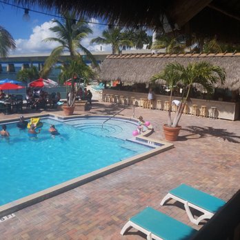 Sunset Grille & Raw Bar - Pool with an additional outside bar. - Seafood Near Me - Marathon, Florida Sunset Grille & Raw Bar - Pool with an additional outside bar. - Seafood Near Me - Marathon, Florida