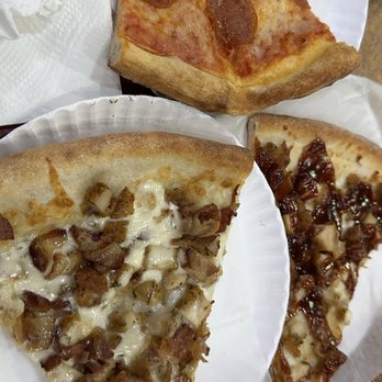 Stage Door Pizzeria - Slices from 18" Stage Door Pizza Special meat and sausages - Pizza Near Me - New York, New York
