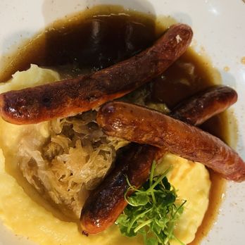 Wirtshaus Ayingers - Spicy sausage mashed potatoes with sauerkraut and brown sauce - German Near Me - Munich, BY Wirtshaus Ayingers - Spicy sausage mashed potatoes with sauerkraut and brown sauce - German Near Me - Munich, BY
