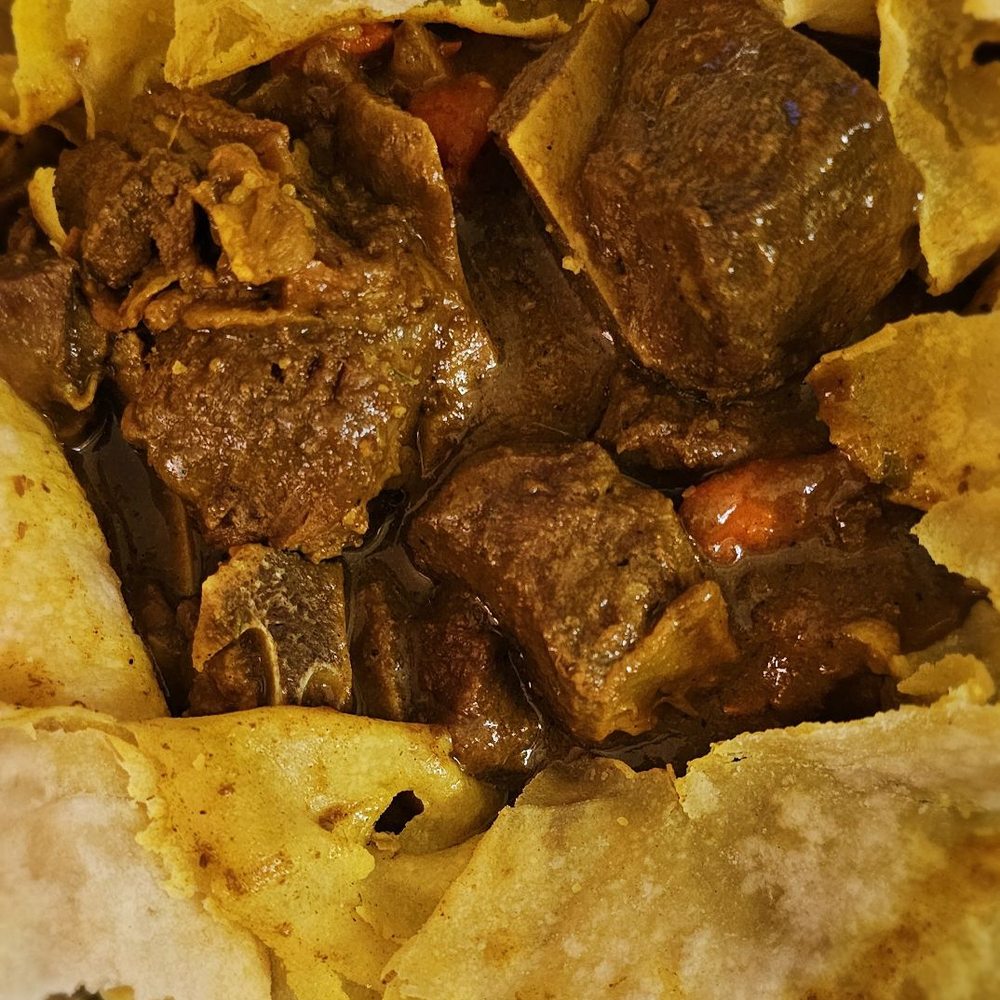 Caribbean Hut - Curry goat roti. Seasoned and tasty - Caribbean Near Me - Charlotte, North Carolina Caribbean Hut - Curry goat roti. Seasoned and tasty - Caribbean Near Me - Charlotte, North Carolina
