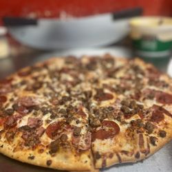 Topped with pepperoni, ham, sausage, and ground beef on a classic crust. Options: small, medium, large, extra large