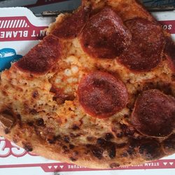 Domino's Pizza - Rock hard, cold burnt thun crust. Not even the style I ordered. Pitiful.