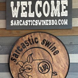 The signs on the wall at the Sarcastic Swine