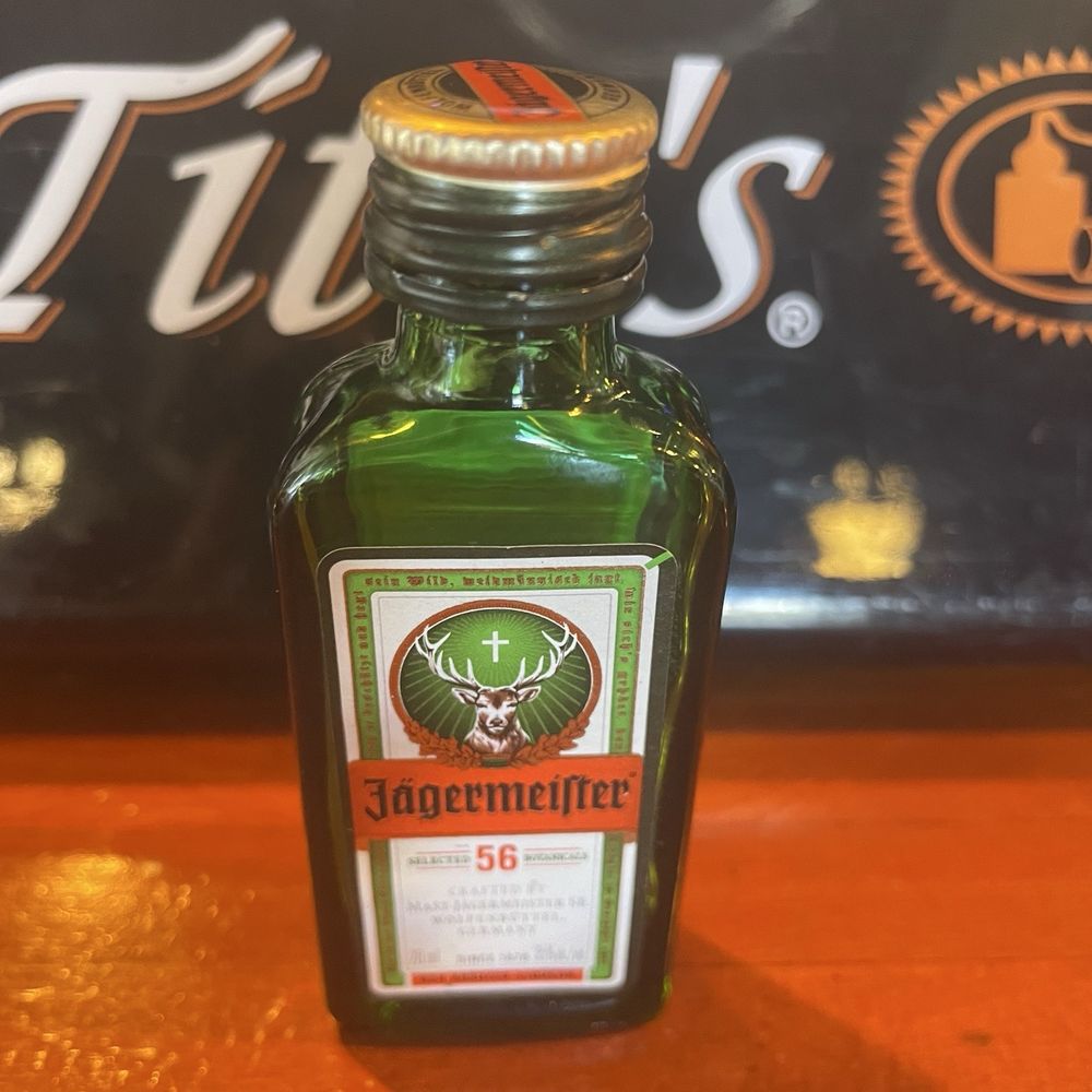 A fridge of cold jager shots at the bar