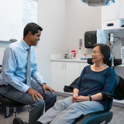 North Texas Oral & Facial Surgery - Dr. Ganti discusses treatment options with a patient.