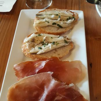 La Feria - Anchovy and tomato crustinis. - Tapas Bars Near Me - Detroit, Michigan La Feria - Anchovy and tomato crustinis. - Tapas Bars Near Me - Detroit, Michigan