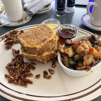 The Boathouse On Naples Bay - Banana bread French toast with a vanilla butter and candied walnuts. The potatoes were also very good! - Seafood Near Me - Naples, Florida The Boathouse On Naples Bay - Banana bread French toast with a vanilla butter and candied walnuts. The potatoes were also very good! - Seafood Near Me - Naples, Florida