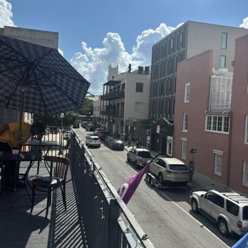 Pour House at District - Balcony view! They have outdoor seating with umbrellas. - Sports Bars Near Me - New Orleans, Louisiana Pour House at District - Balcony view! They have outdoor seating with umbrellas. - Sports Bars Near Me - New Orleans, Louisiana