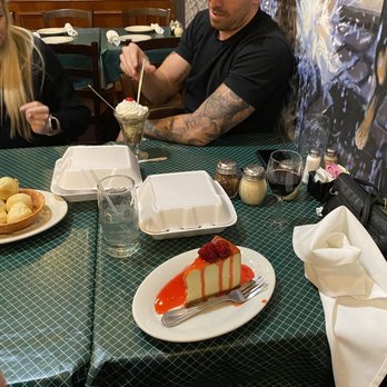 Provino's Italian Restaurant - Cheesecake with strawberry sauce - Italian Near Me - Buford, Georgia Provino's Italian Restaurant - Cheesecake with strawberry sauce - Italian Near Me - Buford, Georgia