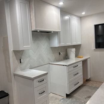 Sanco Construction - Stove and exhaust fan in new kitchen - General Contractors Near Me