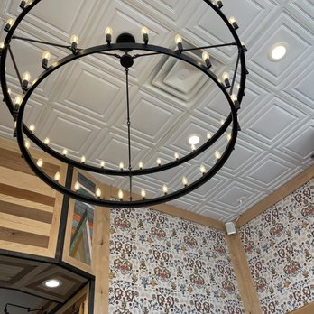 Stell Coffee & Tea - a circular chandelier hanging from the ceiling - Coffee & Tea Near Me - Redlands, California Stell Coffee & Tea - a circular chandelier hanging from the ceiling - Coffee & Tea Near Me - Redlands, California