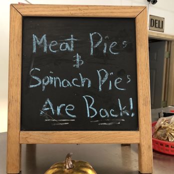 St Paul Flatbread Company - a chalkboard with a sign that says meat pie, sandwich pie, are back - Bakeries Near Me - Saint Paul, Minnesota