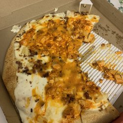Boston Pizza - The overflow of the base thats suppose to be in the pizza, and the pool of hot sauce mess on top... wtf?