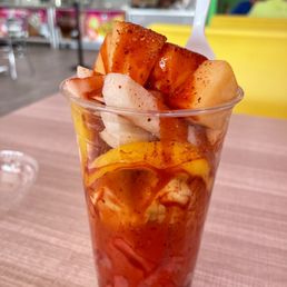 a cold drink with fruit in it a cold drink with fruit in it