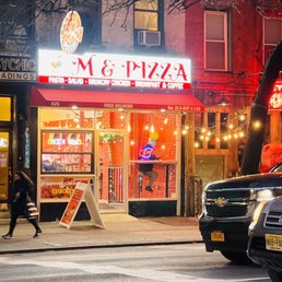 Exterior outside entrance of M & Pizza - Street veiw - New York, New York Exterior outside entrance of M & Pizza - Street veiw - New York, New York
