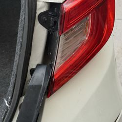 Texas Custom Body & Paint - This is what happened when I opened the trunk when I got my car back. They literally broke my tail lamp cover