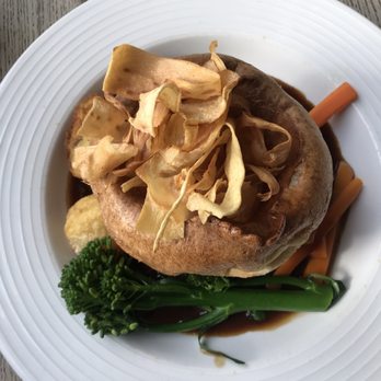 The Cellars - Medallion of beef brisket with red wine jus, Yorkshire pudding, and seasonal vegetables. - Pubs Near Me - London, XGL The Cellars - Medallion of beef brisket with red wine jus, Yorkshire pudding, and seasonal vegetables. - Pubs Near Me - London, XGL