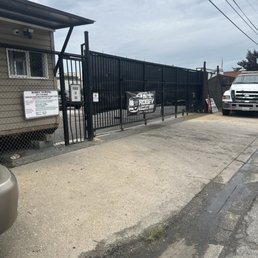 Front of the tow place (you can see no type of bench or chair available) for costumers to wait Front of the tow place (you can see no type of bench or chair available) for costumers to wait