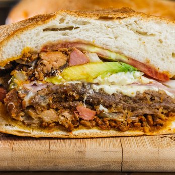 Tortas lokas - a close up of a sandwich on a cutting board - Mexican Near Me - Passaic, New Jersey Tortas lokas - a close up of a sandwich on a cutting board - Mexican Near Me - Passaic, New Jersey