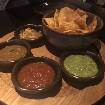 La Popular Austin - Chips and salsa. Green sauce is mild and the spice level progresses with each one. - Mexican Near Me - Austin, Texas