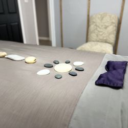 Awaken Wellness Day Spa - LaStone® Massage Therapy blends hydrotherapy techniques for a deep release of tension and therapeutic relaxation.