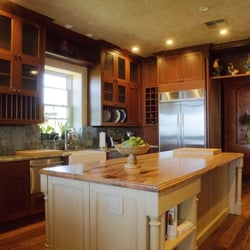Tamara Dattilo Design - French country style custom kitchen, with custom-design floor to ceiling cabinetry. Granite and mango wood counter tops give an exotic look.