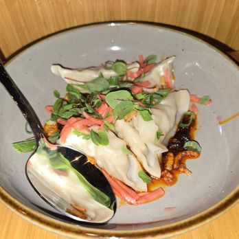 The Kitchen - Pork dumplings in a chili sauce.  Doughy - New American Near Me - Jackson, Wyoming