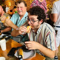 Ybor City Food Tours - Guests enjoying a Cuban sandwich on the Ybor City Food Tour. Tampa, FL