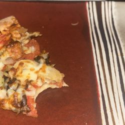 Sicilian Pizza - Pizza with an extra topping a finger nail