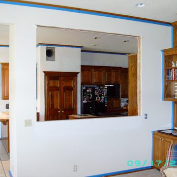 Highlander Construction - a view of a kitchen from the living room - General Contractors Near Me Highlander Construction - a view of a kitchen from the living room - General Contractors Near Me