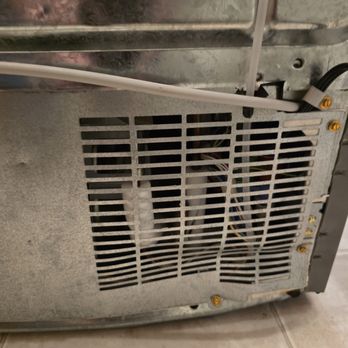 OVA Movers - Bashed in rear of refrigerator - Movers Near Me OVA Movers - Bashed in rear of refrigerator - Movers Near Me