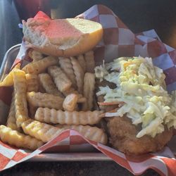 The Hot Mill Crispy fried chicken, pickles, creamy slaw, and drizzled with hot honey on a toasted bun