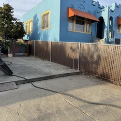 Pro Fence - Side yard chain link fence with brown slat.
