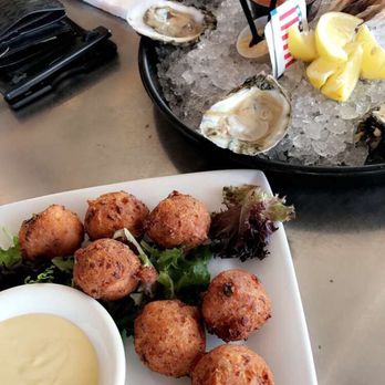 Conch Republic Seafood - Conch fritters and half dozen raw oysters - Seafood Near Me - Key West, Florida