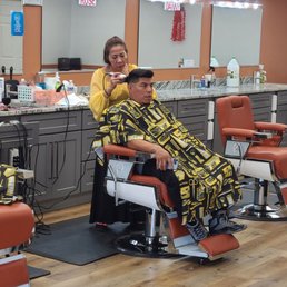 My favorite Barber: Tina, and unknown customer. My favorite Barber: Tina, and unknown customer.