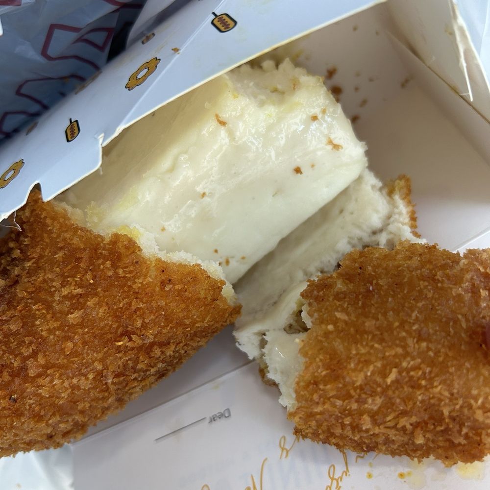 Mochinut - Well that's the cheese dog literally right after leaving... As you can tell very melted. - Donuts Near Me - Bothell, Washington