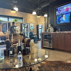 Waiting area has TVs and comfy seats