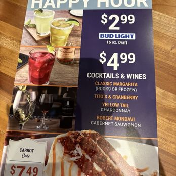 Cheddar's Scratch Kitchen - Happy Hour menu - The flyer features images of cocktails, wines, and a carrot cake dessert, with prices for drinks and dessert at Cheddar's Scratch Kitchen. - Comfort Food Near Me - Florence, Kentucky