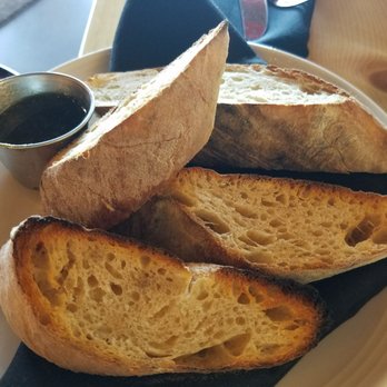 M'tucci's Moderno - Complementary bread with pesto dipping sauce - Italian Near Me - Rio Rancho, New Mexico M'tucci's Moderno - Complementary bread with pesto dipping sauce - Italian Near Me - Rio Rancho, New Mexico