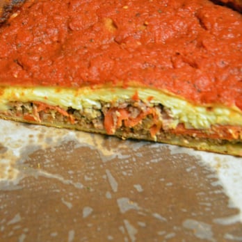 Manhattan Chicago Pizza - Deep-Dish Cross-section (showing pepperoni & cheese) - Pizza Near Me - Pinecrest, Florida Manhattan Chicago Pizza - Deep-Dish Cross-section (showing pepperoni & cheese) - Pizza Near Me - Pinecrest, Florida