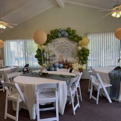 Russell Rentals - Round tables with linen and table runners + our resin chairs for this baby shower in Corona, CA.